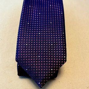 Boss purple tie with some silver squares spotted throughout.